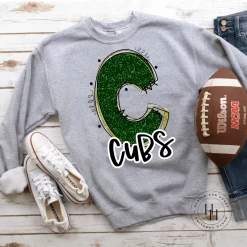 Hustle & Heart NC School Doodle Designs Cubs Dark Green/Yellow Glitter Varsity Doodle