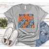 Hustle & Heart NC Hornets Orange/Carolina Blue Repeating Graphic Tee Repeating Mascot Designs