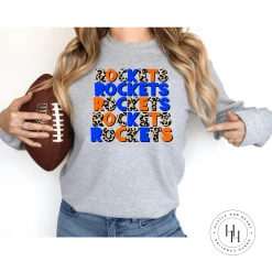 Hustle & Heart NC Rockets Orange/Blue Repeating Graphic Tee Repeating Mascot Designs